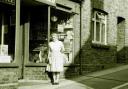 David's mother Winifred outside her shop in Fordington