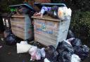 Bins left to overflow in waste backlog