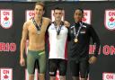 GOLD RUSH: Jacob Peters, centre, came away from the Swim Ontario Junior International with four wins