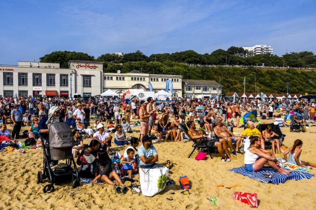 A packed beach watch the Red Arrows in action on day four of the Bournemouth Air Festival.  5th September 2021.  Picture Credit: Graham Hunt Photography.