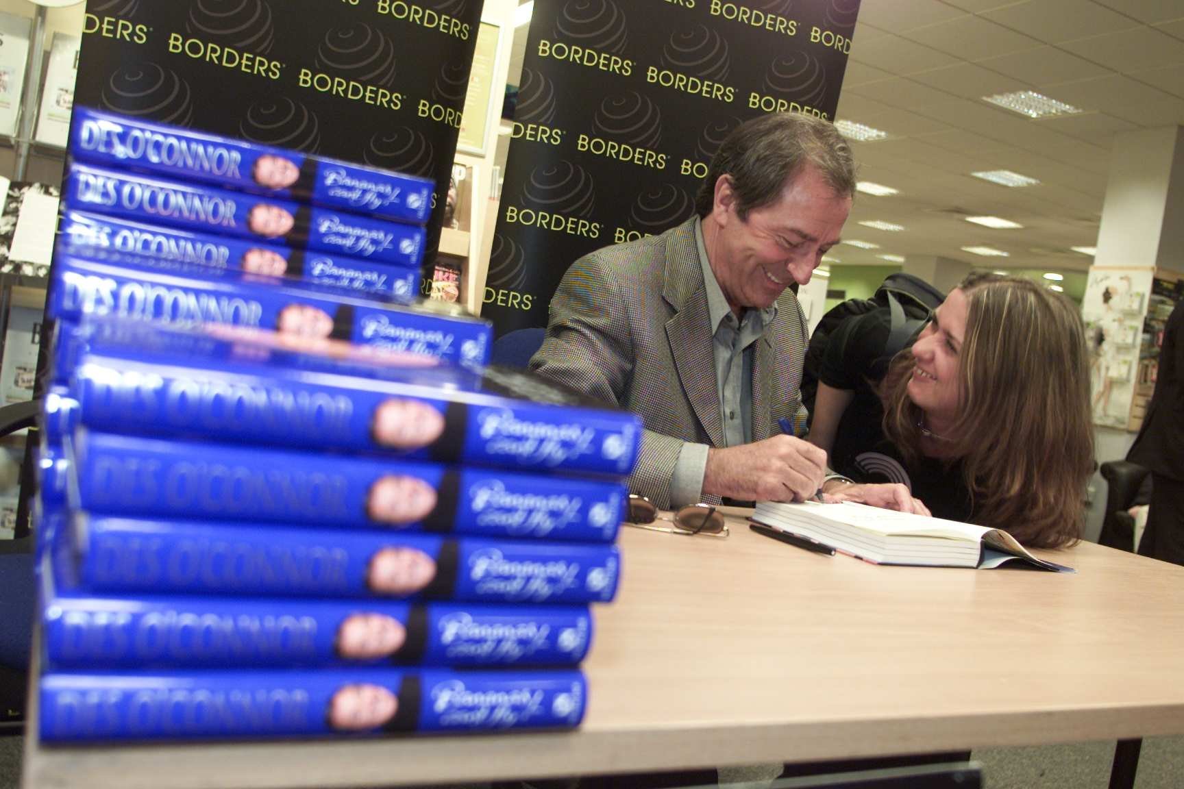 Des OConnor signs his book Bananas Cant Fly at Borders Bookshop. Carolyn Cunningham from Charminster.