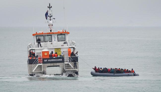 A group of people thought to be migrants are rescued off the coast of Folkestone, Kent by a Border Force vessel on Saturday (Gareth Fuller/PA)