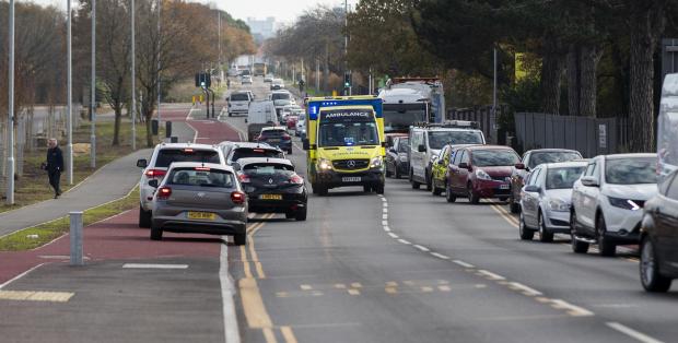 Bournemouth Echo: Traffic has to drive onto the cycle lane to allow ambulance to pass. Picture: BNPS