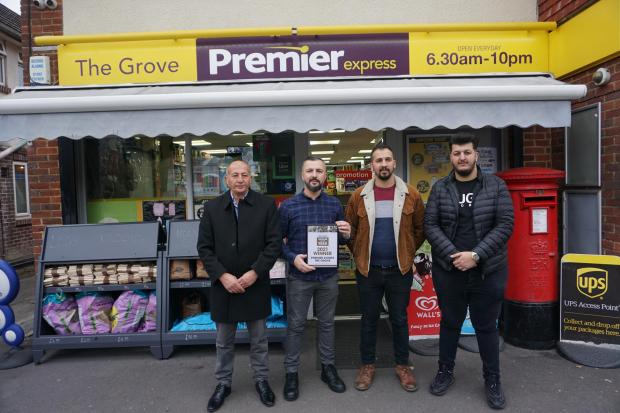 Bournemouth Echo: From left to right: Huseyin Gunduz, Tacim Gunduz, Volkan Gunduz and Burak Gunduz, owners of the Premier store on The Grove in Christchurch with their Retailer of the Year award