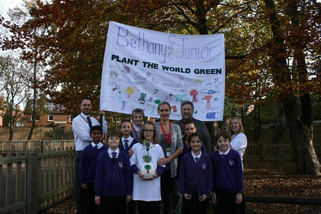 To celebrate the 2026 reforestation of Britain, along with Her Majesty The Queen's Platinum Jubilee in 2022, nine- year-old Issey Purser, in white, and Bethany C.E Junior School In Bournemouth, Dorset, have come up with the idea of planting new