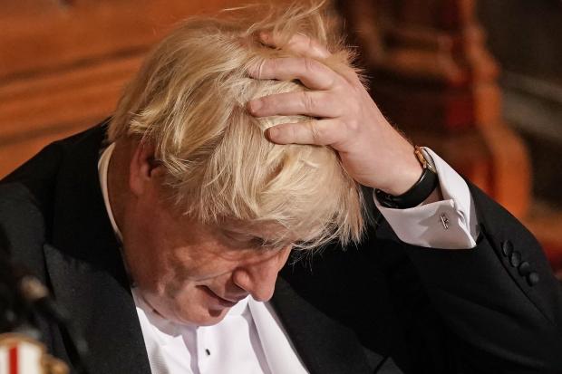 Bournemouth Echo: Boris Johnson with his hand on his head. Credit: PA