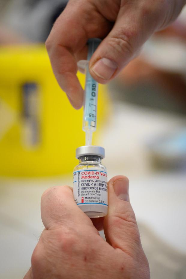 Bournemouth Echo: A Covid vaccine being prepared. Credit: PA