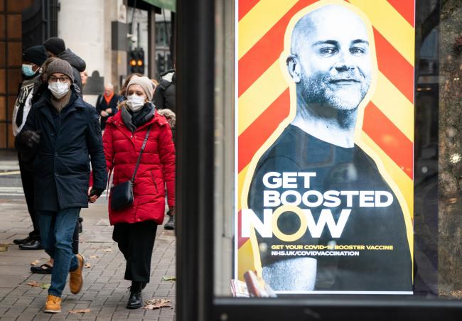 Photo via PA shows the Government's Get Boosted Now campaign rolled out across the nation's highstreets.