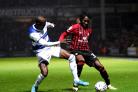 Queens Park Rangers' Albert Adomah (left) and Bournemouth's Jordan Zemura battle for the ball during the Sky Bet Championship match at the Kiyan Prince Foundation Stadium, London. Picture date: Monday December 27, 2021. PA Photo. See PA story