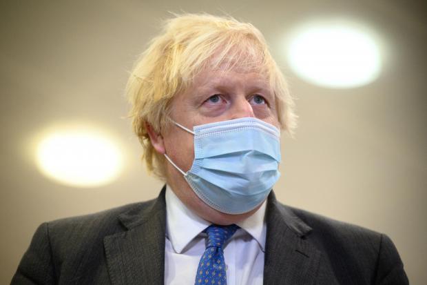 Bournemouth Echo: Boris Johnson wearing a mask. Credit: PA