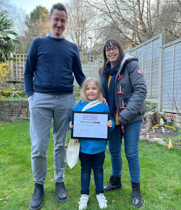 Bournemouth Echo: Young carer Emberly Heppenstall with her parents and ambassador certificate