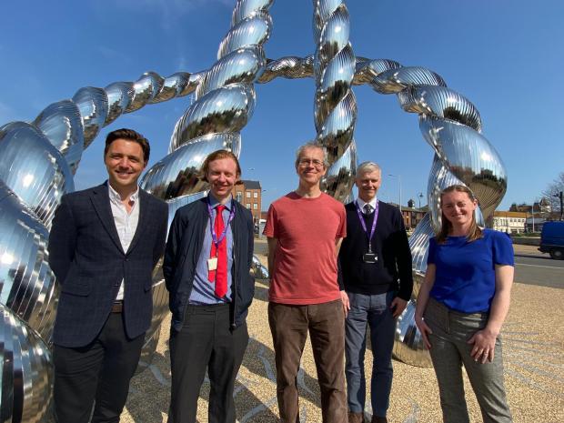 Bournemouth Echo: (L-R) Councilor Philip Broadhead, Engineer Michael Hadley, Artist Michael Condron, Rosie McNamara of the Dorset Local Enterprise Partnership and Julian McLaughlin BCP service director at The Bottle Knot sculpture in Hunger Hill, Poole