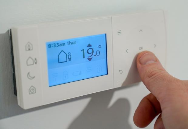 Bournemouth Echo: Niraz Buhari says for every degree you turn down your thermostat you can save an estimated 10 per cent of energy. Picture: PA