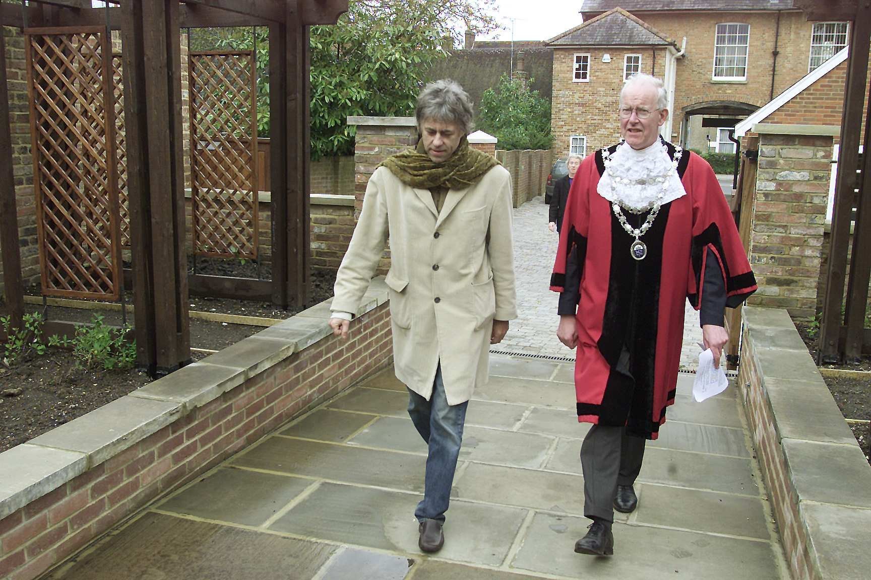 Bob Geldof in Wimborne on the day of his concert at the Tivoli Theatre: Bob Geldof walks up the Physic Garden with Wimborne Mayor Anthony Oliver.