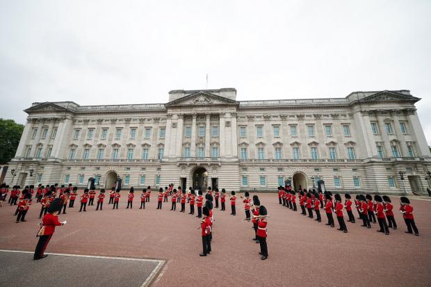 Bournemouth Echo: Members of the Nijmegen Company Grenadier Guards and the 1st Battalion the Coldstream Guards take part in the Changing of the Guard, in the forecourt of Buckingham Palace. Picture: PA