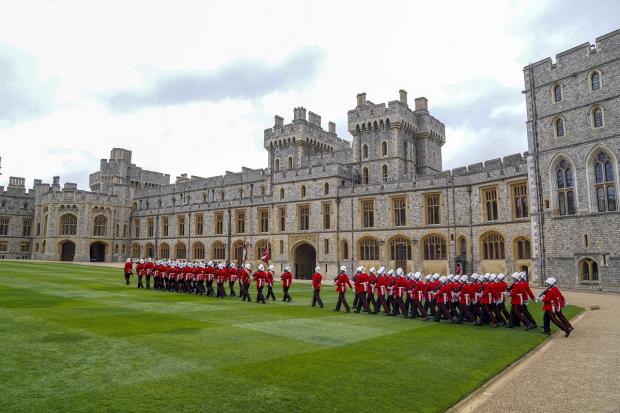 Bournemouth Echo: The Earl of Wessex presents new colours to the Royal Gibraltar Regiment during a ceremony at Windsor Castle. Picture: PA