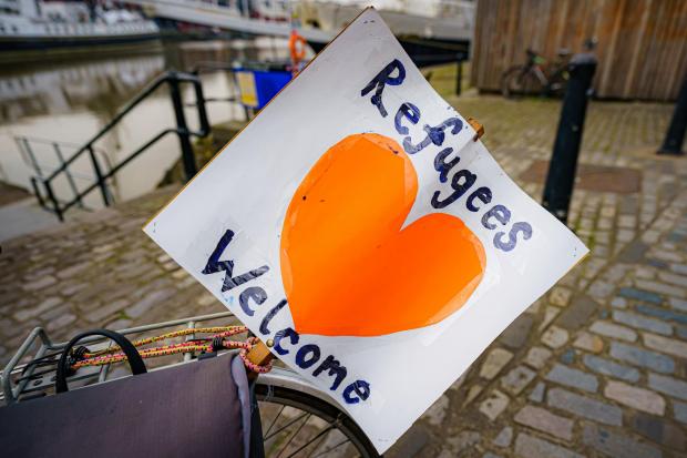 Bournemouth Echo: Refugees welcome sign. Credit: PA