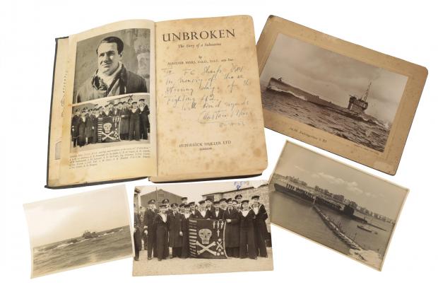 Bournemouth Echo: The book 'Unbroken, the story of a submarine' dedicated to Petty Officer Sharp by the author and sub's captain, which is to go under the hammer at The Tank Museum in a Duke's of Dorchester sale. The photos include one with the crew