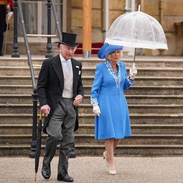 Bournemouth Echo: The Prince of Wales and the Duchess of Cornwall during a Royal Garden Party at Buckingham Palace. Picture: PA