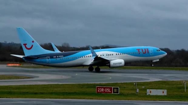 Bournemouth Echo: The TUI flight landed late in Gatwick. (PA)