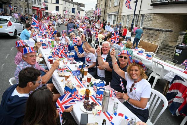 Bournemouth Echo: Residents enjoying a knees-up in Swanage. Picture: Finnbarr Webster. 