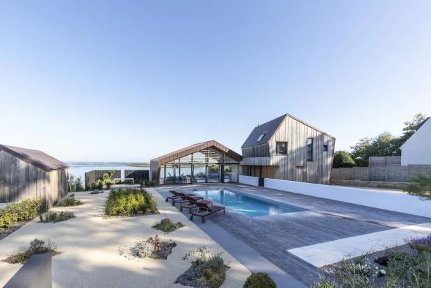 Bournemouth Echo: Modern villa with stunning sea views, swimming pool, Jaccuzi - Brittany, France. Credit: Vrbo