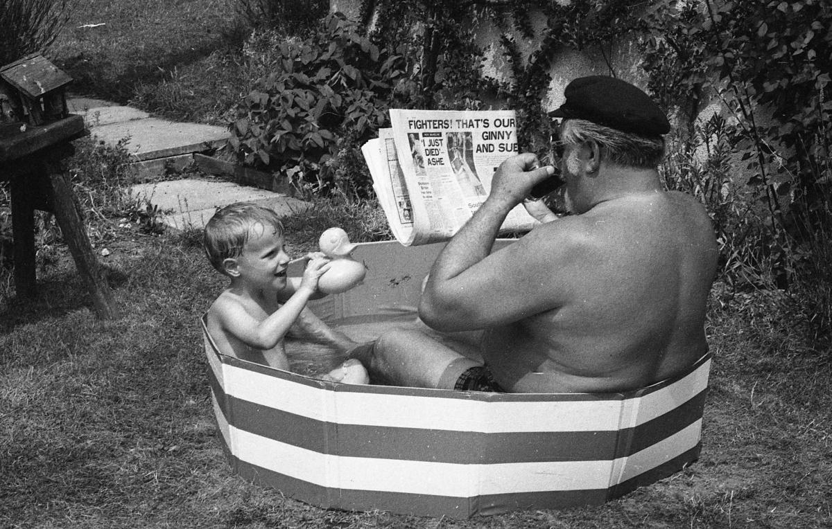 Keeping cool in the heat Echo photographer Harry Ashley and his grandson 28th June 1976.