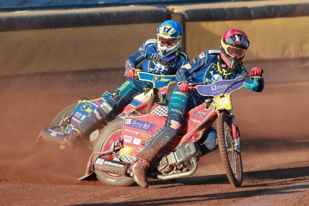 Poole Pirates  v Plymouth Gladiators in Championship Speedway at Wimborne Road. Heat 2 -  Drew Kemp (red) and Nathan Ablitt (blue).