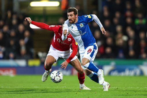 Blackburn Rovers Joe Rothwell (right) in action during the Sky Bet Championship match at Ewood Park, Lancashire. Picture date: Wednesday December 29, 2021.