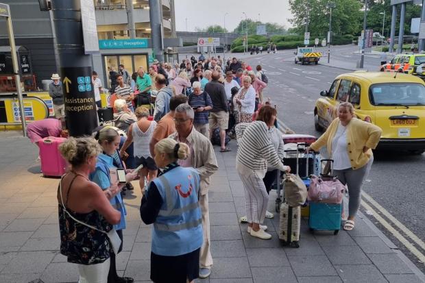Bournemouth Echo: Bournemouth passengers waiting in Gatwick Airport after a flight from Tenerife