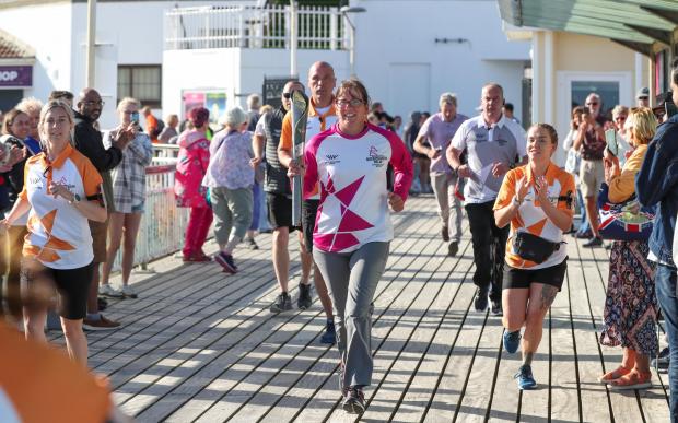 Bournemouth Echo: The Queen's Baton Relay on Bournemouth Pier. Picture by Richard Crease.