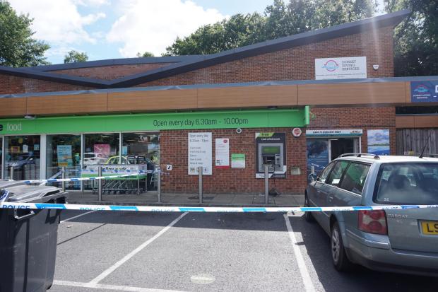 Bournemouth Echo: A cordon was in place outside the Co-op store on Ringwood Road