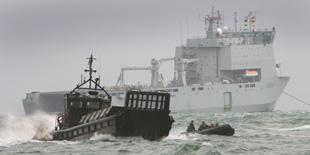 Marines come in close to shore with their landing craft and rib