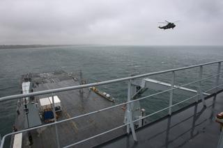 Bournemouth Air Festival Day Three - Day on RFA Largs Bay  -  Sea King helicopter prepares to land on the flight deck
