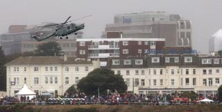  Bournemouth Air Festival Day Three - Day on RFA Largs Bay  -  One of the Black  Cats display team entertains the crowds on the clifftop