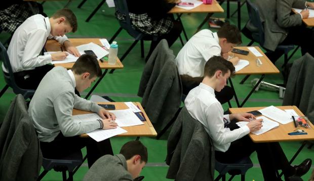 Bournemouth Echo: An AQA walkout could delay GCSE and A Level results. Picture: PA
