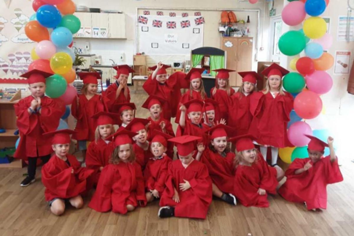 Youngsters from Blandford Children’s Centre Nursery after a mini-graduation in July. Picture: Dorset Council