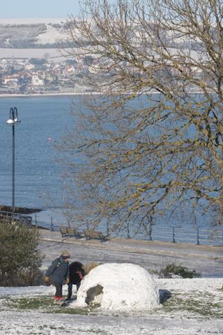 Swanage after a dusting of snow. 
A couple stumble across an igloo. 