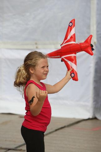 Pictures from the final day of the Bournemouth Air Festival 2011. Tia Lavell,5 , from Upton came with her family to pay respects to Red Arrows pilot Jon Egging.