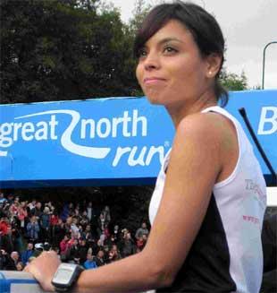 EMOTIONAL TRIBUTE: Dr Emma Egging watches as the Red Arrows fly over the start line of the Great North Run, in the “missing man” formation, in honour of her late husband Flt Lt Jon Egging