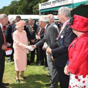 25 July 2012 - The Queen pictured during her visit to the New Forest Show - the Queen meeting dignitaries and organisers