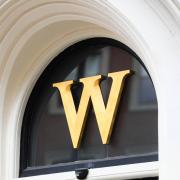 Waterstones 'W' hanging above one of its branches. Credit: PA