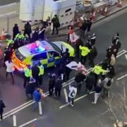 Video grab image courtesy of Conor Noon of clashes between police and protesters in Westminster as officers use a police vehicle to escort Labour leader Sir Keir Starmer to safety. Picture taken on Monday, February 7.