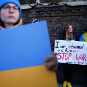 A woman claiming to be a Tatar (centre), a Turkic ethnic group native to the Volga-Ural region of Russia, protests against the Russian invasion of Ukraine outside the Russian Embassy in Kensington, London.