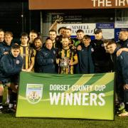 Poole Town celebrate after the Dorset Senior Cup final between Hamworthy United and Poole Town on Tue 1st March 2022 at The County Ground, Hamworthy, Dorset. Photo: Ian Middlebrook.