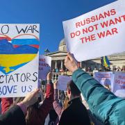 People holding signs 'RUSSIANS DO NOT WANT THE WAR' take part in a demonstration in Trafalgar Square, London, on February 27, 2022. Photos via PA.