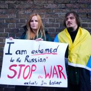 A woman claiming to be a Tatar, a Turkic ethnic group native to the Volga-Ural region of Russia, protests against the Russian invasion of Ukraine outside the Russian Embassy in Kensington, London. (PA)