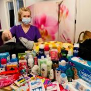 Kasia Rudzinska shows off items collected at Highcliffe Nursing Home for Ukrainian refugees. Photo sent by Stephen Pullinger.