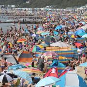 Find a quieter spot in Bournemouth, Christchurch and Poole with the Beach Check app. Picture: PA