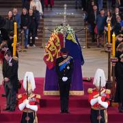 Queen's eight grandchildren hold vigil as Prince Harry wears military uniform